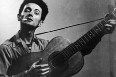 Woody Guthrie with cigarette